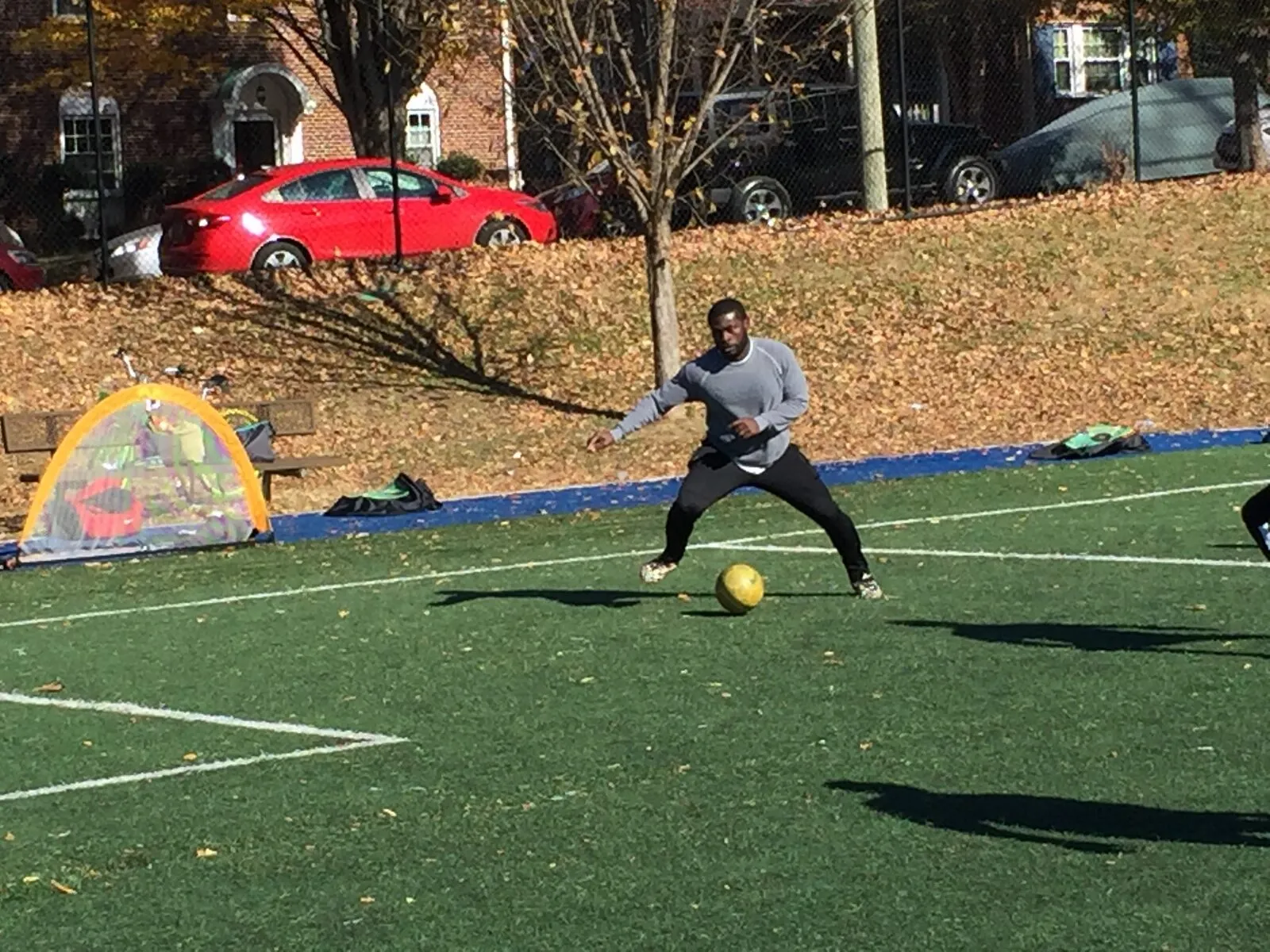 2017: A player in a grey top about to kick a yellow ball.