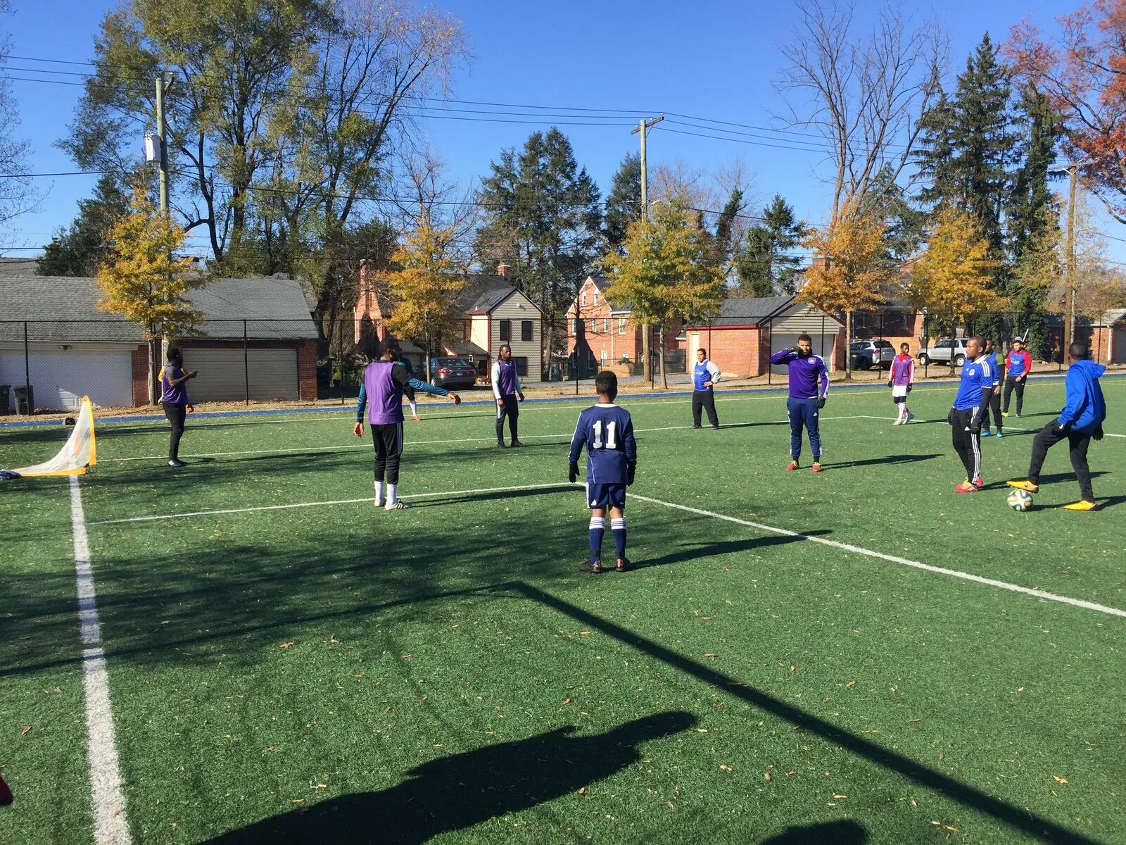 2017: A wide view of a turf field with many small games going on at once.