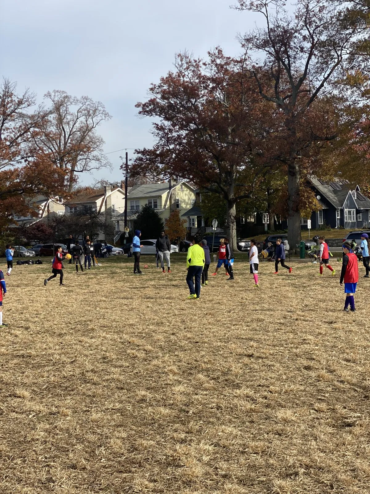 2021: Players spread across a grassy field on Thanksgiving morning, in the middle of a pick-up game.