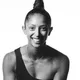 Breanna Browning, smiling, in a black and white photo with her hair in a high bun