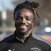 Coach James Kpainay smiling