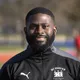 Coach Mike Idiokitas smiling